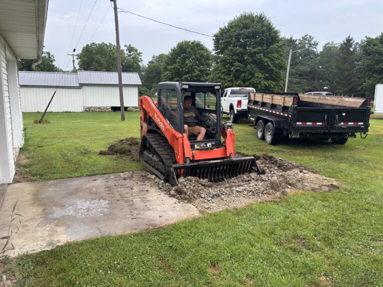 Concrete contractor with skid steer in Hillsdale, Michigan